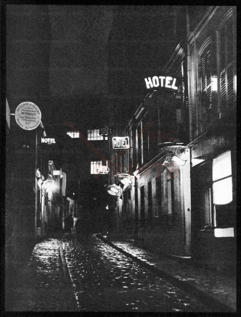 Brassai an old street in Paris by Night