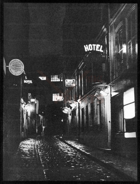Brassai an old street in  Paris by Night